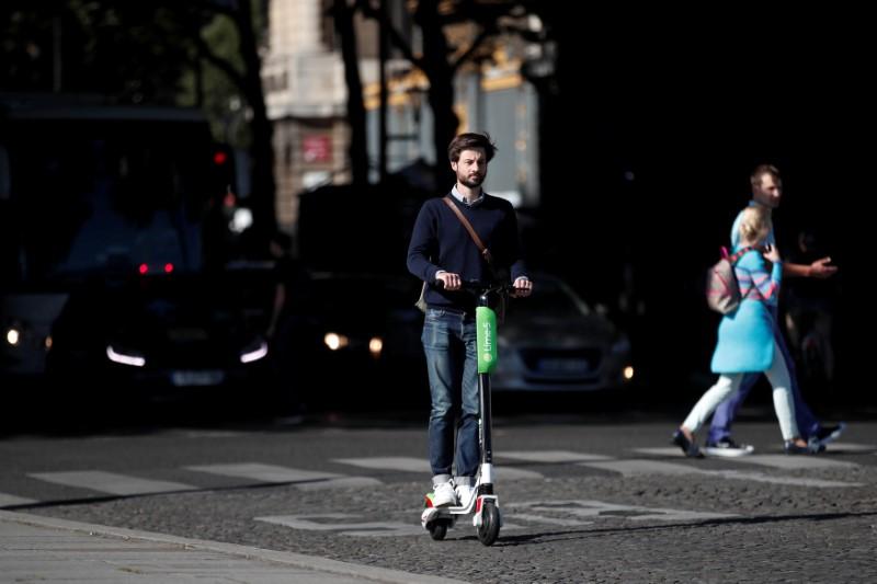 Lime’s France director Arthur-Louis Jacquier rides a dock-free electric scooter Lime-S by California-based bicycle sharing service Lime on their launch day in Paris