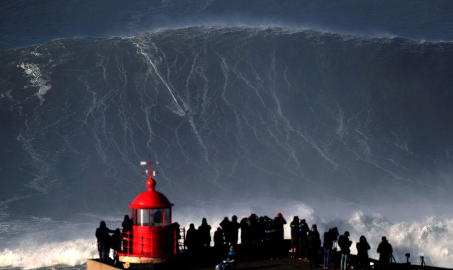 Big wave surfer Sebastian Steudtner of Germany drops in on a large wave at Praia do Norte in Nazare