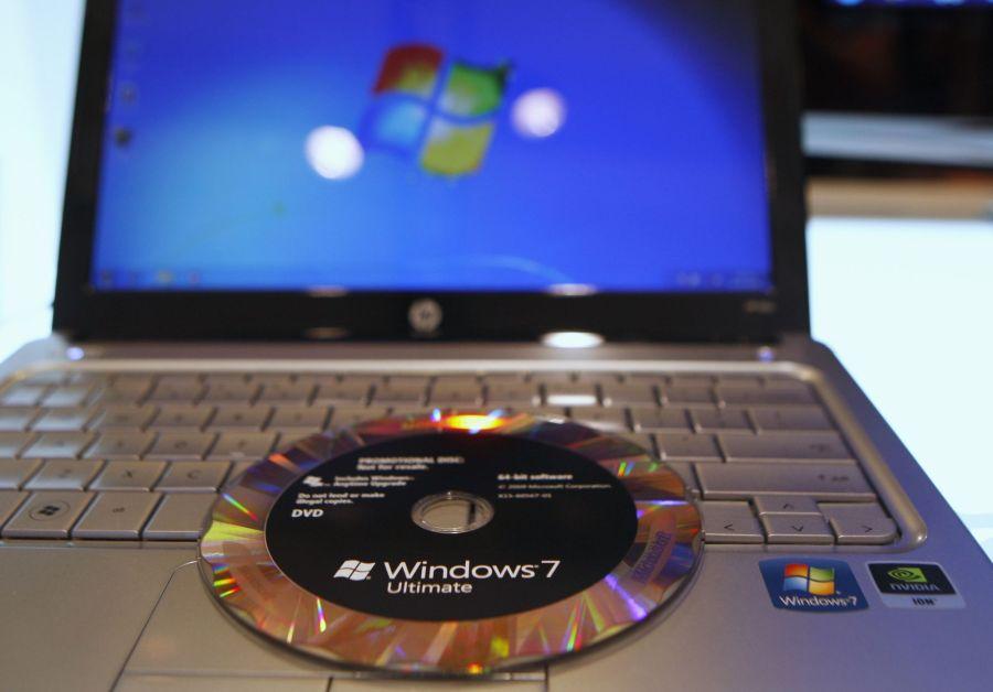The new Windows 7 operating system installation DVD is pictured on a notebook at the Windows 7 Launch Party in New York