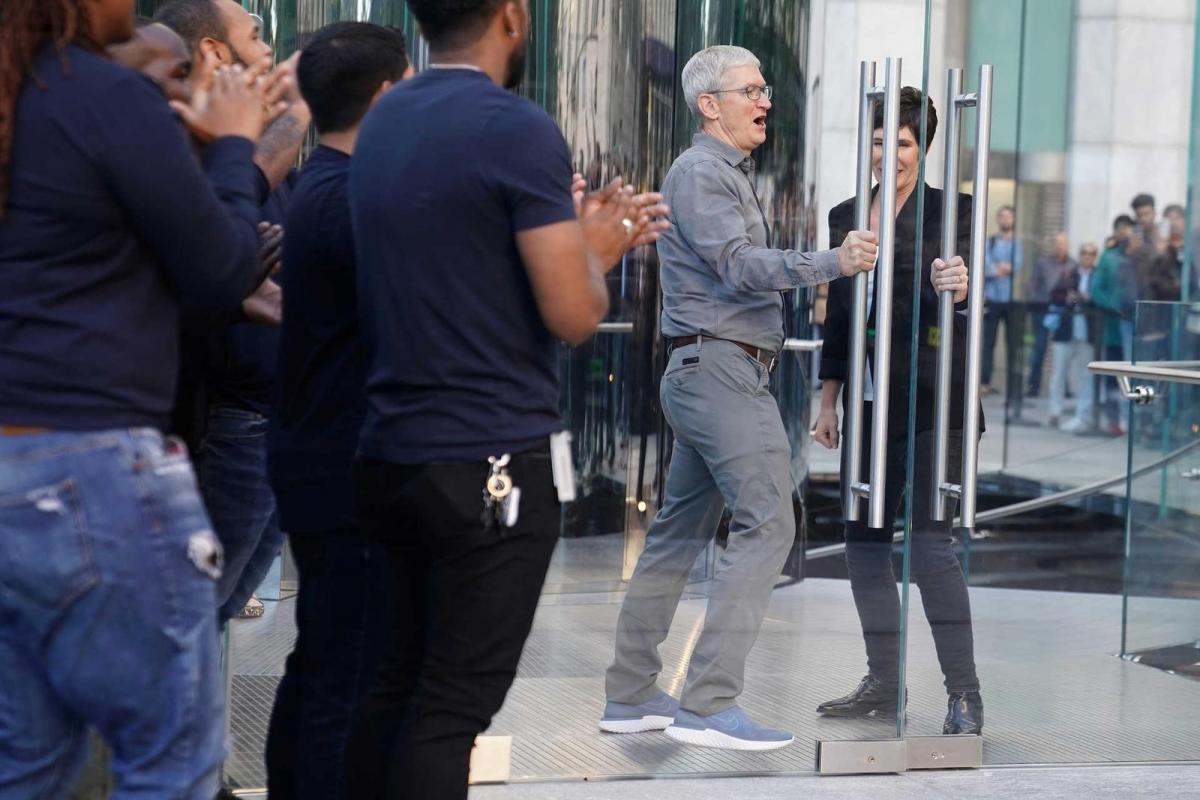 Apple CEO Tim Cook arrives to greet fans outside the Apple Store on Fifth Ave in the Manhattan borough of New York