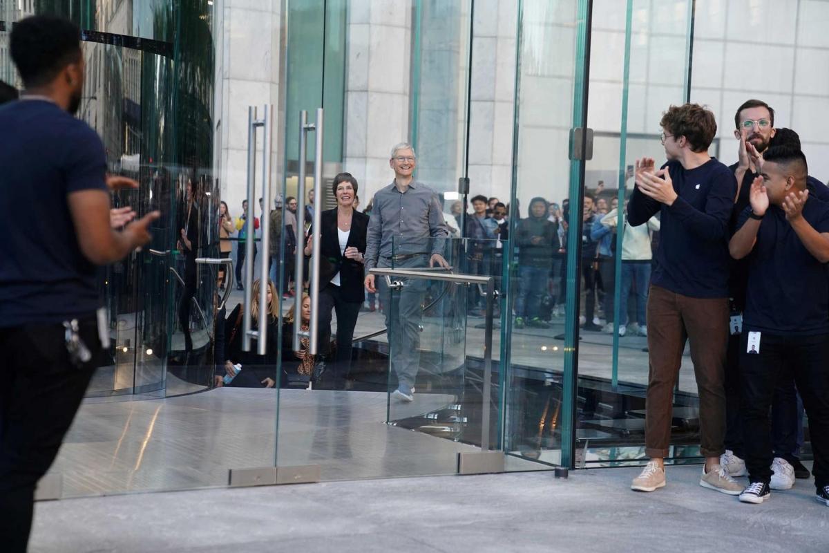 Apple CEO Tim Cook arrives to greet fans outside the Apple Store on Fifth Ave in the Manhattan borough of New York